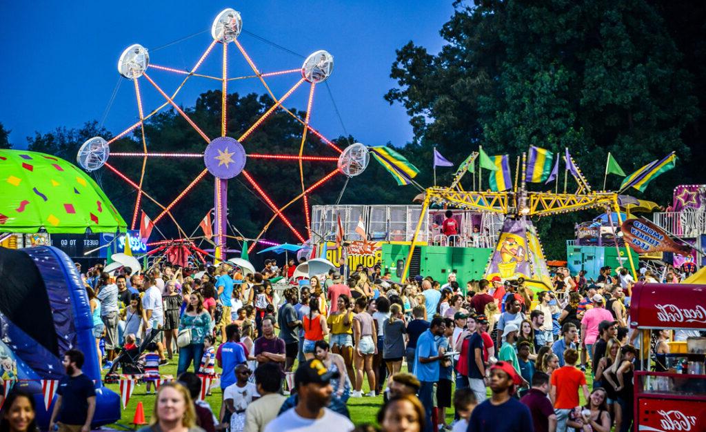 people gather at a carnival